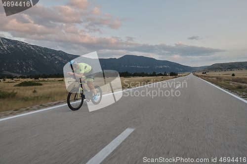 Image of triathlon athlete riding bike