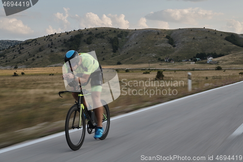 Image of triathlon athlete riding bike