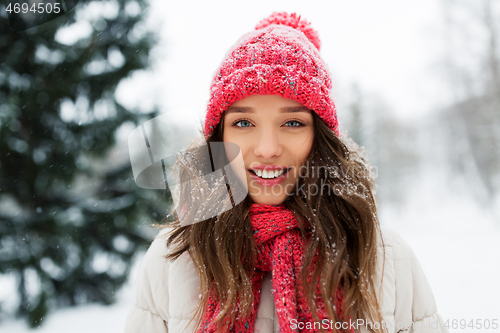 Image of smiling teenage girl outdoors in winter