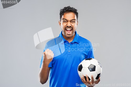 Image of football fan with soccer ball celebrating victory