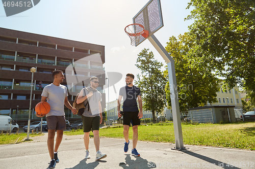 Image of group of male friends going to play basketball