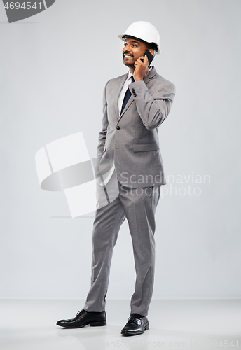 Image of indian male architect calling on smartphone