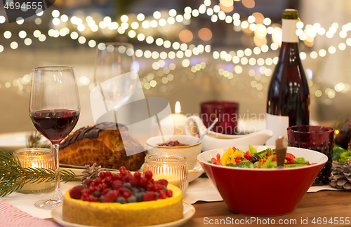 Image of food and drinks on christmas table at home