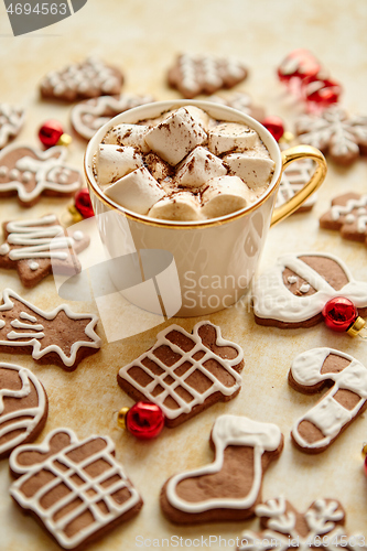 Image of Cup of hot chocolate and Christmas shaped gingerbread cookies