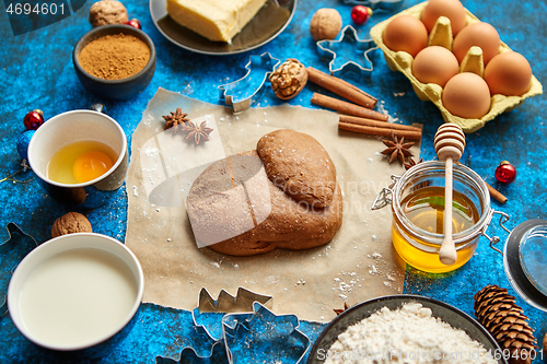 Image of Gingerbread dough placed among various ingredients. Christmas baking concept