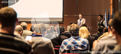 Image of Business speaker giving a talk at business conference meeting event.