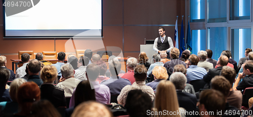 Image of Business speaker giving a talk at business conference meeting event.