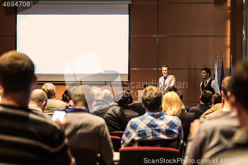 Image of Business speaker giving a talk at business conference meeting event.