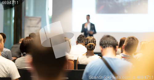 Image of Male business speaker giving a talk at business conference event.