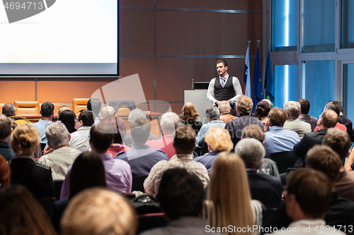 Image of Business speaker giving a talk at business conference meeting event.