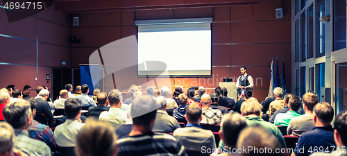 Image of Business speaker giving a talk at business conference meeting event.