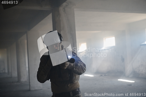 Image of modern warfare soldier in urban environment battlefield