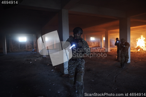 Image of military troops in action urban environment