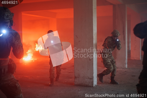 Image of military troops in action urban environment