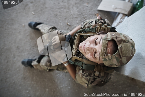 Image of military female soldier having a break