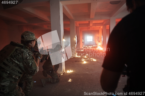 Image of military troops in action urban environment