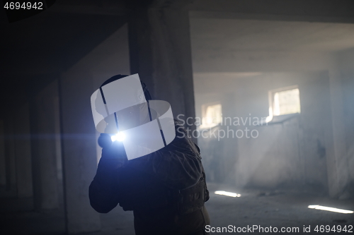 Image of modern warfare soldier in urban environment battlefield