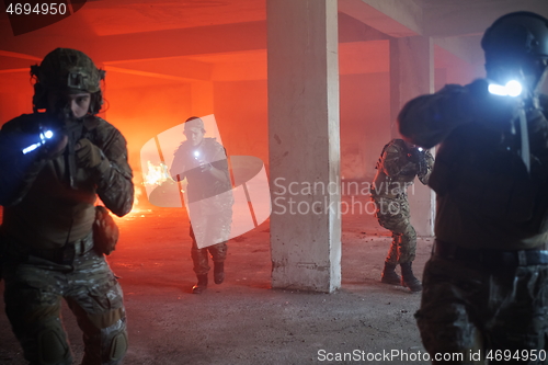 Image of military troops in action urban environment