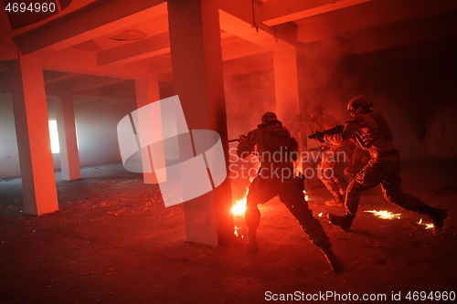 Image of military troops in action urban environment