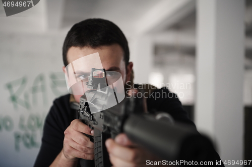 Image of special agent soldier aiming wearing casual clothing