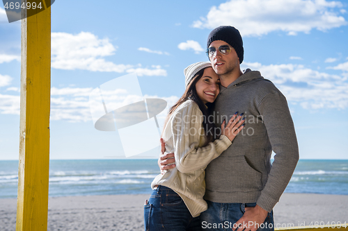 Image of Couple chating and having fun at beach bar