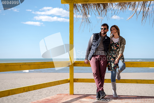 Image of Couple chating and having fun at beach bar