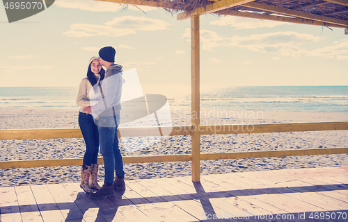 Image of Couple chating and having fun at beach bar