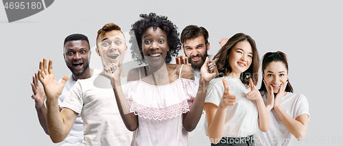 Image of The collage of faces of surprised people on white backgrounds.