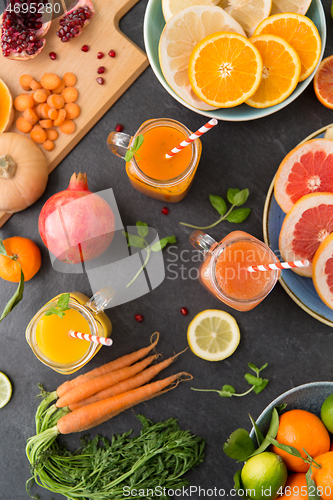 Image of mason jar glasses of vegetable juices on table