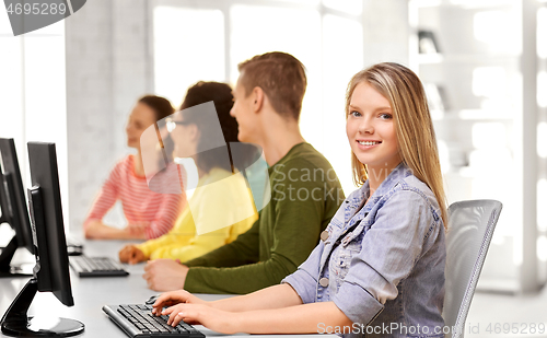 Image of happy high school students in computer class