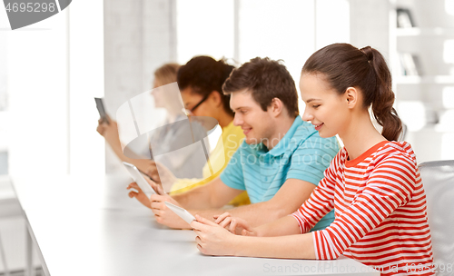 Image of high school students with tablet computers