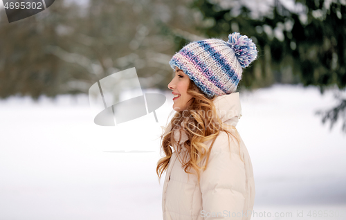 Image of happy smiling woman outdoors in winter