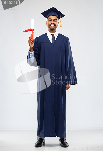 Image of graduate student in mortar board with diploma