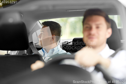 Image of middle aged male passenger and car driver