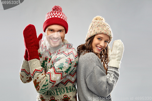 Image of happy couple at christmas ugly sweater party