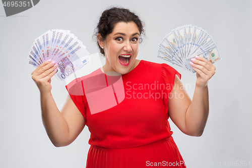 Image of happy woman holding thousands of money banknotes