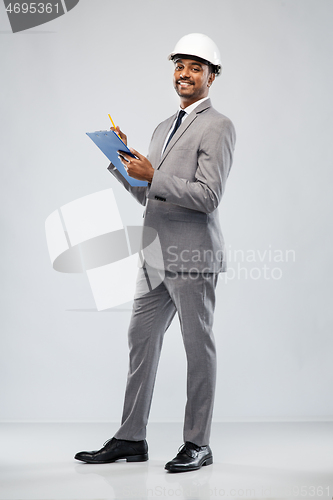 Image of indian male architect in helmet with clipboard