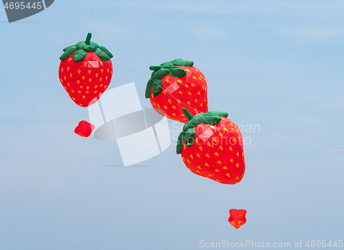 Image of Strawberry kites flying