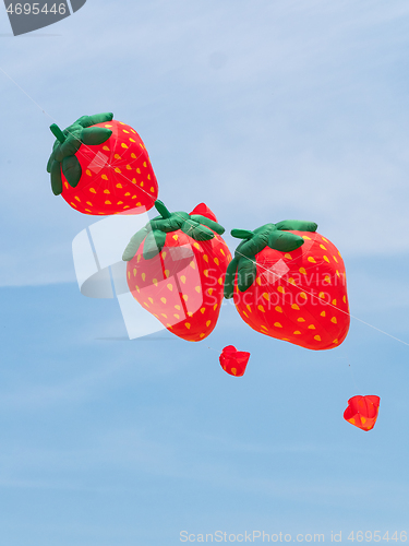 Image of Strawberry kites flying