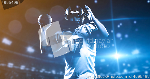 Image of american football player throwing rugby ball