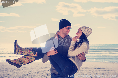 Image of Couple chating and having fun at beach bar