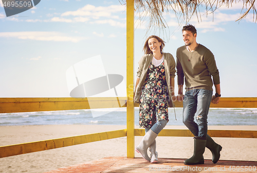 Image of Couple chating and having fun at beach bar