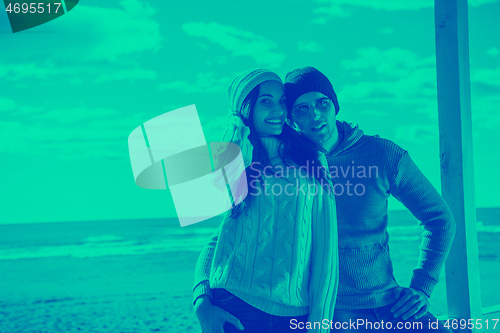 Image of Couple chating and having fun at beach bar