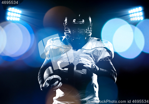 Image of portrait of confident American football player