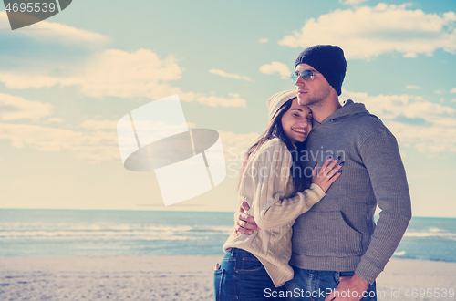 Image of Couple chating and having fun at beach bar