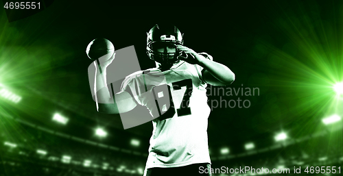 Image of american football player throwing rugby ball