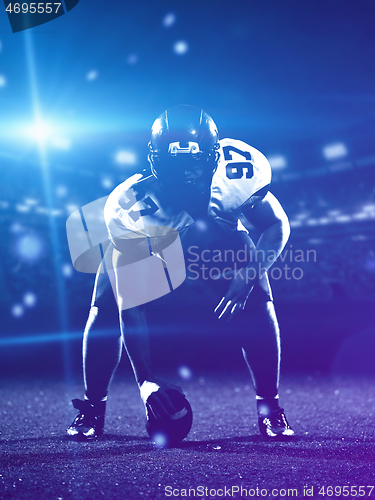 Image of American football player starting football game