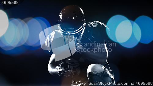 Image of portrait of young confident American football player