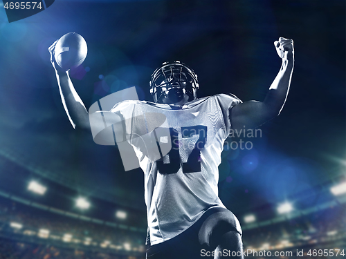 Image of american football player celebrating after scoring a touchdown