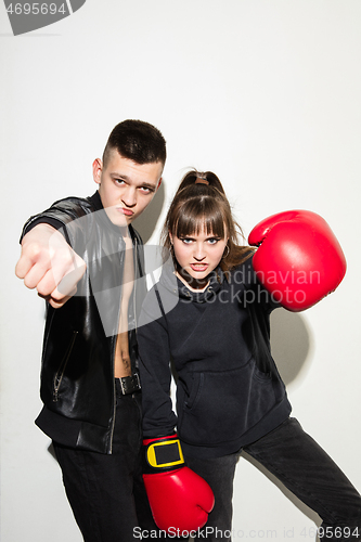 Image of Close up fashion portrait of two young pretty hipster teens